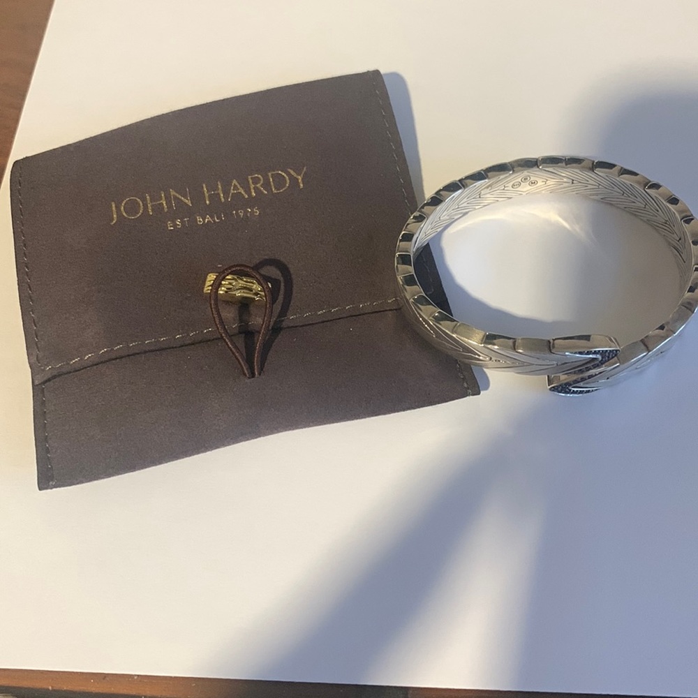 John Hardy flexible cuff bracelet.Slightly adjustable.Stones are black sapphires